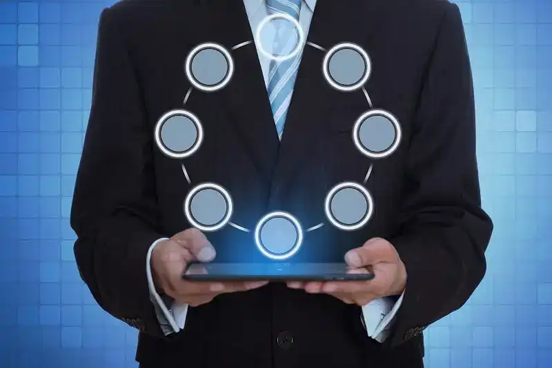 Unveiling the Future: Mastering GRC in the Cloud Revolution with Vault Security Solutions 13 man with holographic tablet